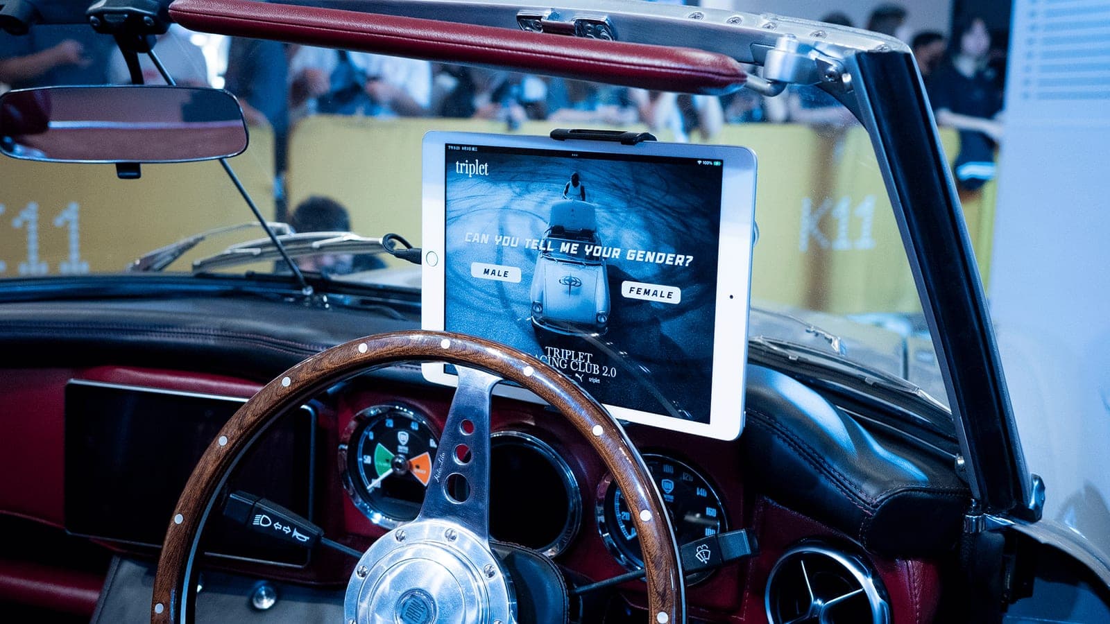 The convertible's dashboard, with the booth's tablet mounted above the steering wheel.