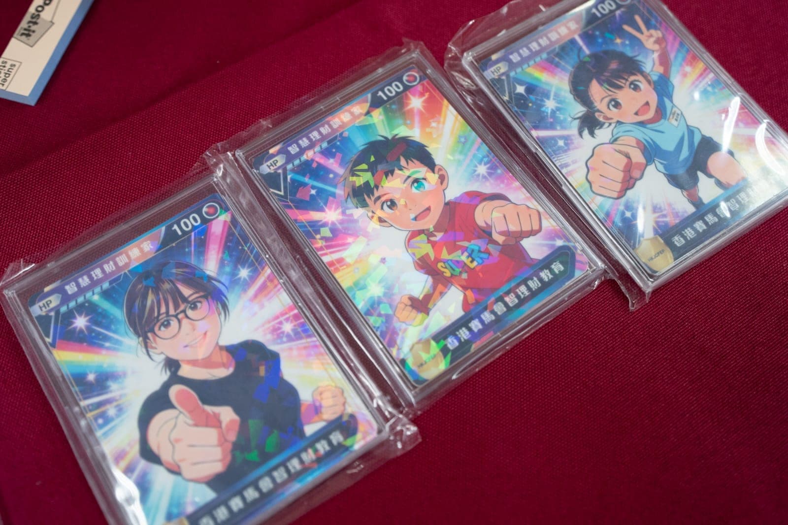 Three personalised game-card style photos in display cases.